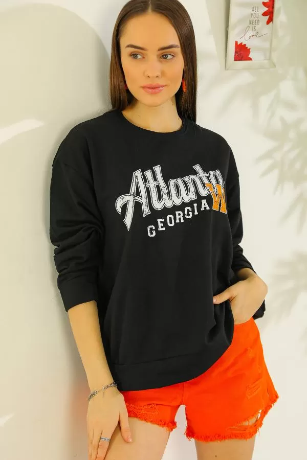 https://customers.birissine.com/public/uploads/product_gallery/baskili-oversize-sweat-siyah-3329.webp