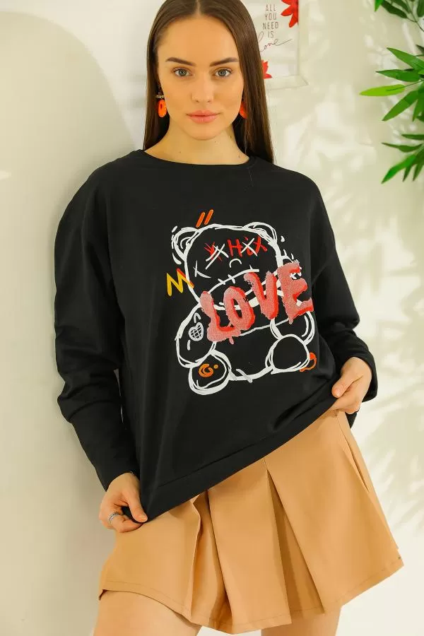 https://customers.birissine.com/public/uploads/product_gallery/baskili-oversize-sweat-siyah-4598.webp