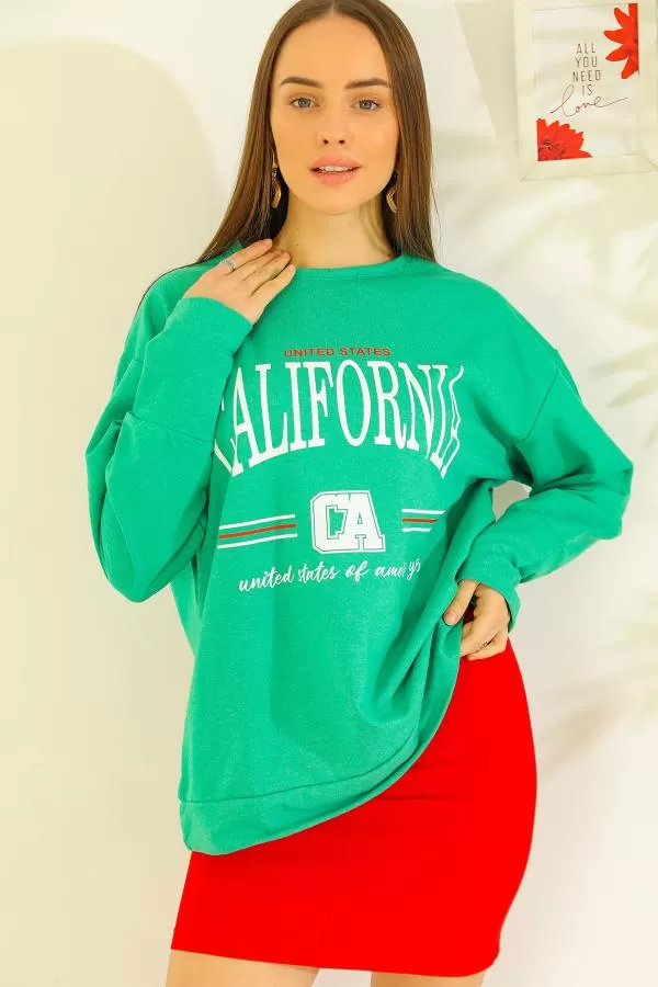 https://customers.birissine.com/public/uploads/product_gallery/baskili-oversize-sweat-yesil-4457.webp